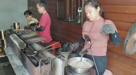 Malaysian street food: Women makes Barquillo, the perfect crispy snack