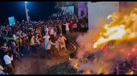 Man runs through blazing flames during traditional event in Mathura, India