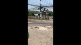 Concrete post falls from building onto cars parked below after earthquake