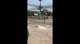 Concrete post falls from building onto cars parked below after earthquake