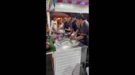 Fast-handed chefs uses steak spatulas to chop Oreos for ice cream