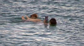 UK Weather, Sea swimming with a best friend, Newquay Harbour, Cornwall, UK