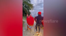 Father and son drown while washing car in river in Indonesia