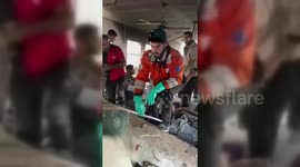 A young Palestinian man, trapped under the rubble of a destroyed building in Gaza