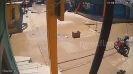 Bikers narrowly escape sinkhole as it opens under them and swallows up their motorcycle