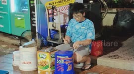 Young street performancer uses waste goods as music instruments