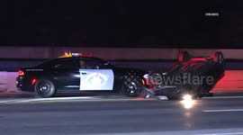 US, Los Angeles: North Hills Rollover CHP Pushes Car Off Freeway
