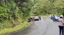 White Sedan Car Has Brake Failure Dragging Motorcyclist Trapped Under Car