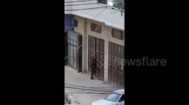 Israeli forces close shops belonging to Palestinians during their raid on Madma village
