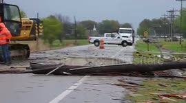 Workers clear storm debris from Lake City, Arkansas