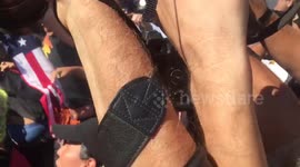 US flag goes up flames during protest outside RNC convention in Cleveland