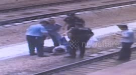 Man pushed onto train tracks escapes being run over