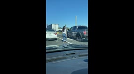 Lady Pulls Pistol on Man at Traffic Altercation