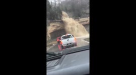 Water rushes down road after heavy rain in Madison, Indiana, USA