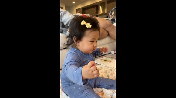 Baby girl copies family dog's bark in adorable fashion