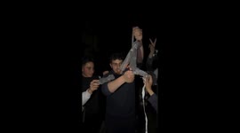 People swing burning steel wool, creating sparks in Gaza