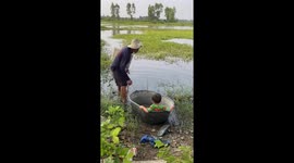 Adult pulls child in bucket, child falls into water in Chon Buri