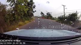 Thailand: Motorcycle sidecar rider swerves in front of car then rolls into ditch