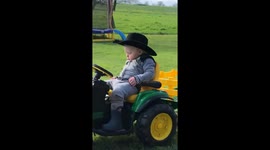 Kid Nods Off Driving Toy Tractor