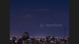 Timelapse of Moonrise in downtown São Paulo Dec/2020. Full moon among many flying helicopters