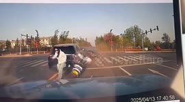 Car collision sees vehicle hurtle towards cyclist who dodges just in time