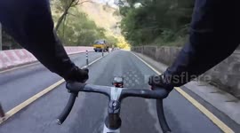 China: Car Makes Illegal Lane Change, Nearly Hits Cyclist