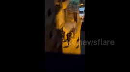 Israeli forces arrest a number of young men during the storming of Shuafat camp