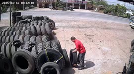 Tyre with life of its own 'runs off' from shopfront in China leaving owner deflated