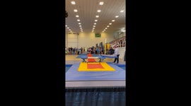 Gymnast has a crazy save while doing trampoline flips at a competition