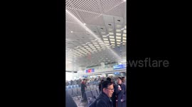 Water cannon uses to extinguish fires suddenly soaks passengers at Chinese train station