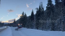 US: Excavator Clears Snow From Road Ahead of Travel Delays in Cottonwood Canyons