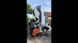 People fill balloon with hot air over fire in Blitar, East Java