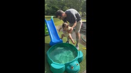 Hilarious moment tiny one-year-old hits the splits to avoid the cold pool