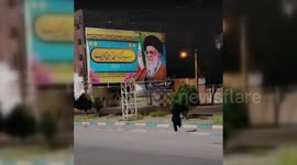 Iran: Iranian Protester Sets Fire to Supreme Leader's Banner in Tehran