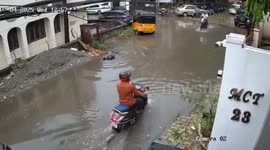 Brave Man save the boy who fell into water aftre being electrocuted by a leak in underground power cables in Chennai, South India