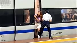 Passenger spreads her legs to stop train door from closing