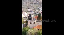 Israeli forces occupy the rooftop of a house during a raid into the town of Jaba', north of the West Bank
