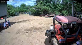 Woman topples from moving tractor on farm in Thailand