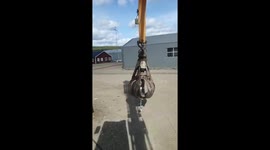 Person picks up scooter with crane arm and rides it in Borlänge