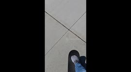 Old man trying to skateboard