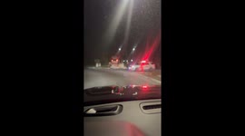 Car ends up on top of concrete sign in Providenciales