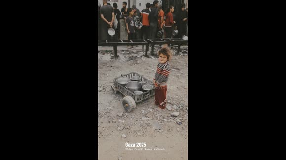 Gaza Strip, Palestine: Palestinian children line up for a free meal in Beit Lahia, Gaza Strip