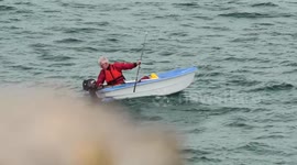 A good Samaritan sailor helps an angler, gets entangled, nearly sinks. Newquay Harbor, Cornwall, UK