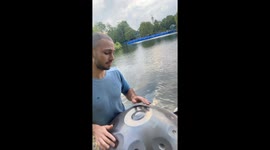 Handpan performance in the park takes an unexpected twist as a swan shows up
