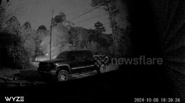 I have a camera outside of my house because of prowlers messing with my truck and one night this is what it captured.... A Demon comes out from atop of the trees and goes down under a truck and then it goes around the side of the truck
