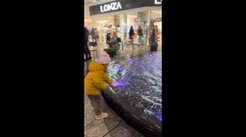 Child startled by sudden fountain jet in Dnipro, Ukraine