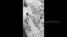Sudden hailstorm turns streets into rivers of ice in central China