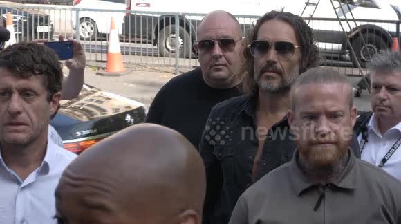 Russell Brand enters Westminster Magistrates Court in London to face charges