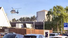 Shoppers shocked as mysterious figures rope down from choppers - near Tesco