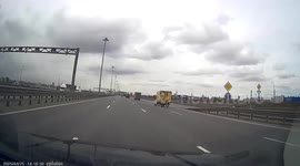 Lorry loses two wheels as driver struggles to stop it tipping on its side